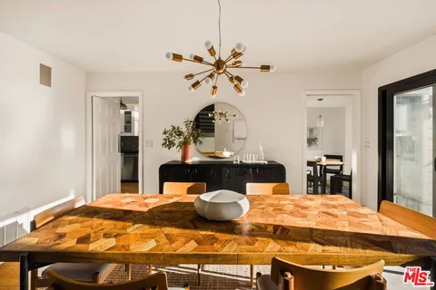 a kitchen with stainless steel appliances granite countertop a stove and a refrigerator
