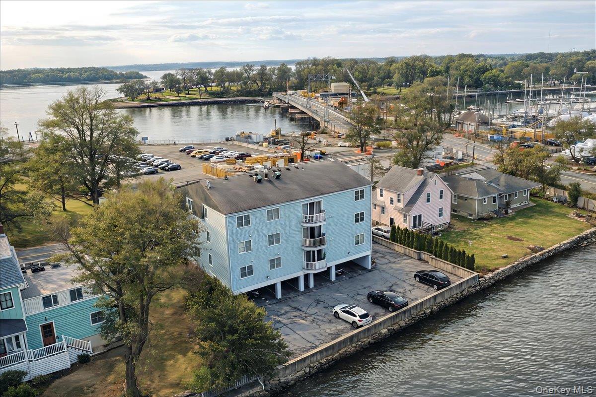37 Harbor Lane, Unit 2A New Rochelle, NY 10805 - Photo 18 of 22 a view of a lake with houses