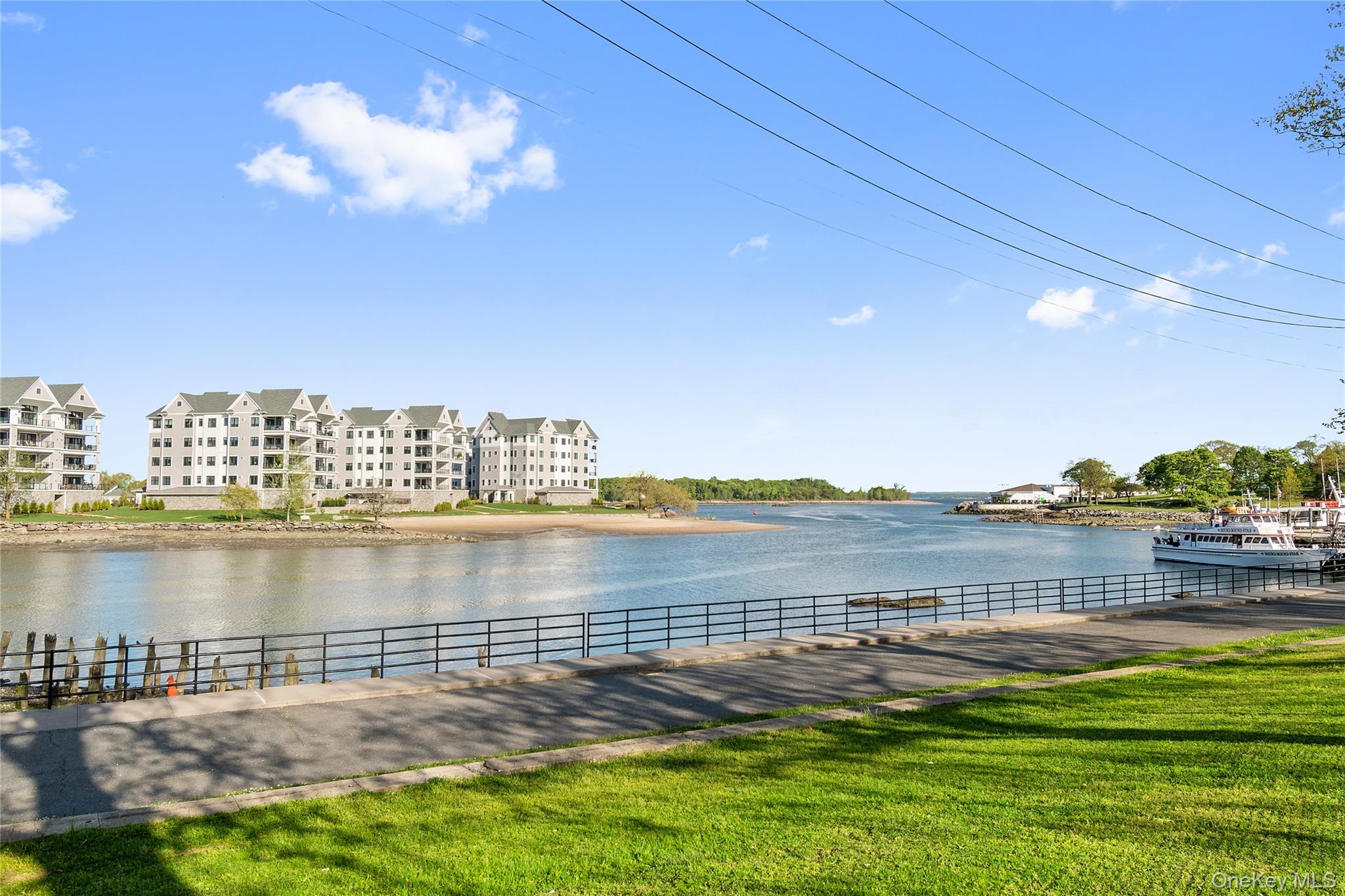 37 Harbor Lane, Unit 2A New Rochelle, NY 10805 - Photo 20 of 22 a view of a lake with houses in the back