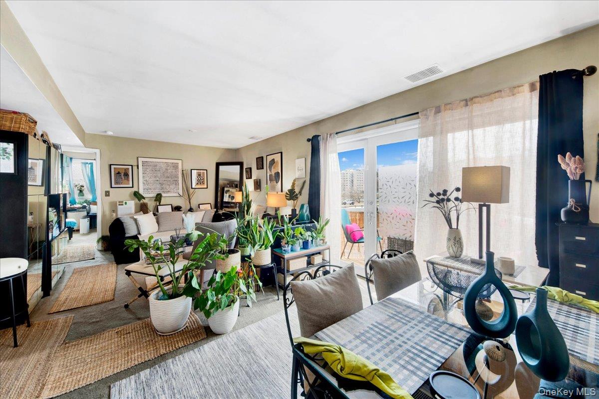 37 Harbor Lane, Unit 2A New Rochelle, NY 10805 - Photo 3 of 22 a living room with furniture flowerpot and window