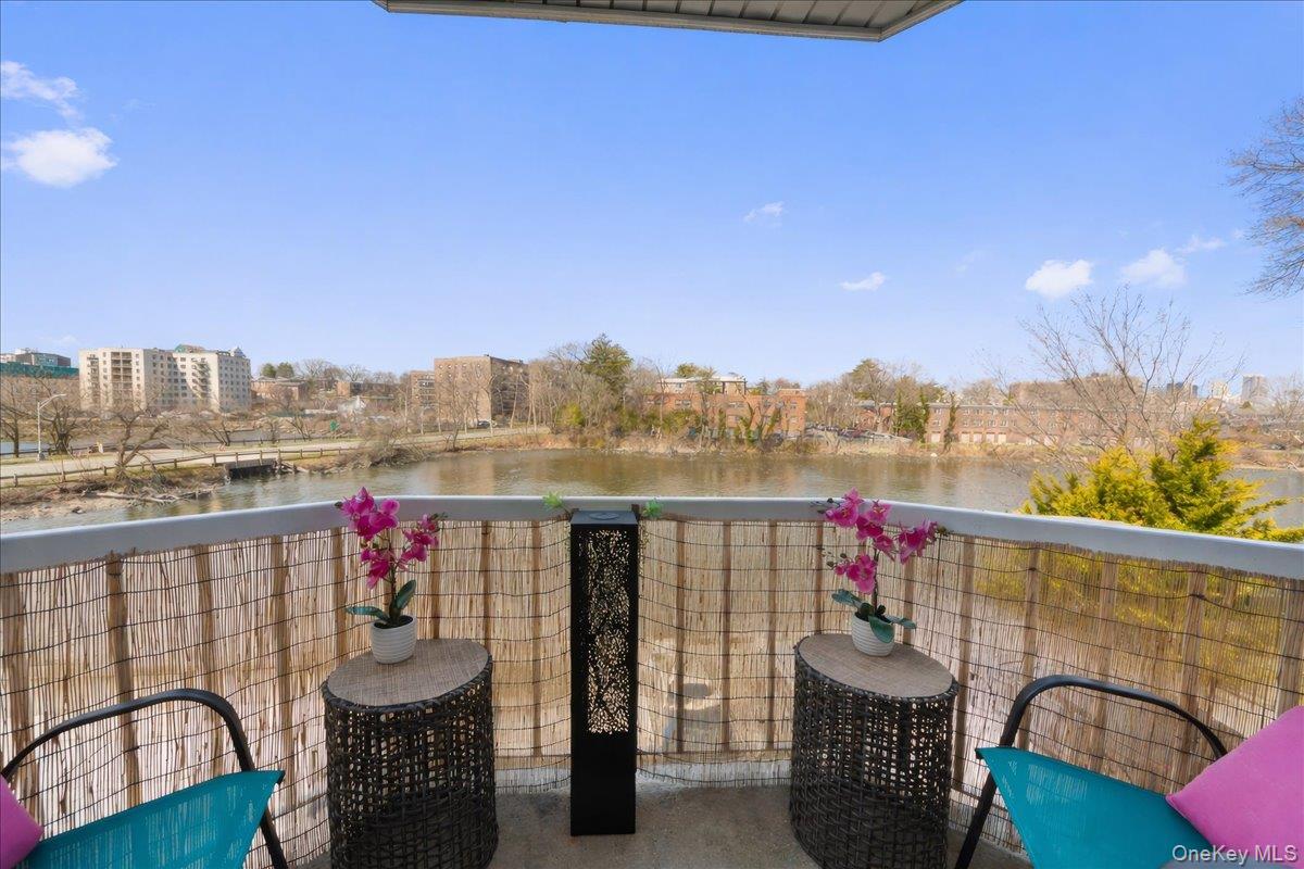 37 Harbor Lane, Unit 2A New Rochelle, NY 10805 - Photo 7 of 22 a view of a chairs and table in the balcony