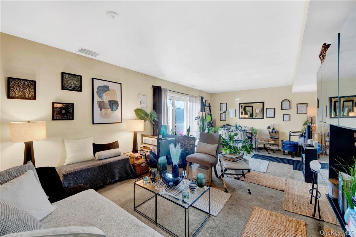 37 Harbor Lane, Unit 2A New Rochelle, NY 10805 - Photo 10 of 22 a living room with furniture and a flat screen tv