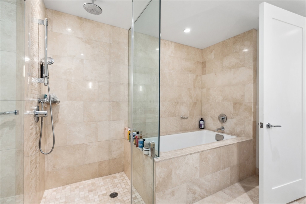 1 Franklin Street, Unit 2507 Boston, MA 02110 - Photo 16 of 37 a bathroom with a shower and a bathtub