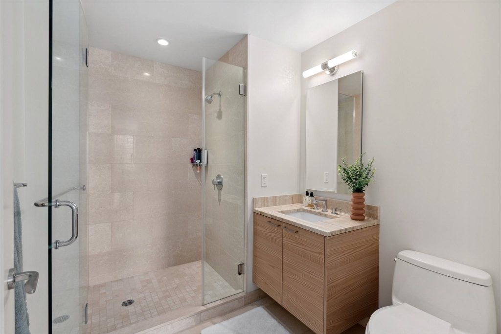 1 Franklin Street, Unit 2507 Boston, MA 02110 - Photo 21 of 37 a bathroom with a sink toilet and shower
