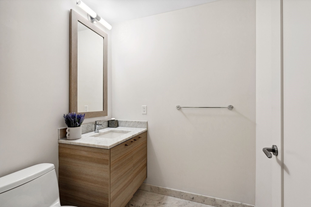1 Franklin Street, Unit 2507 Boston, MA 02110 - Photo 22 of 37 a bathroom with a sink and a toilet