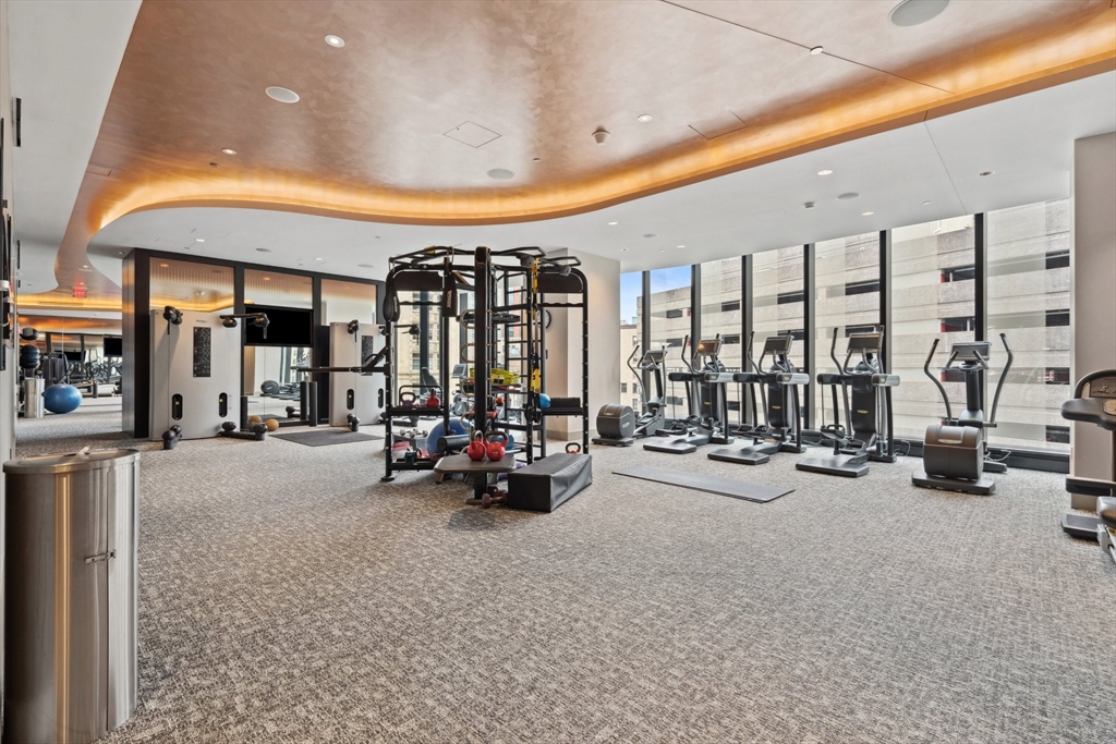 1 Franklin Street, Unit 2507 Boston, MA 02110 - Photo 26 of 37 a view of a room with gym equipment