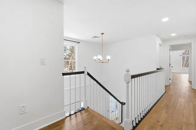 a view of a hallway with windows