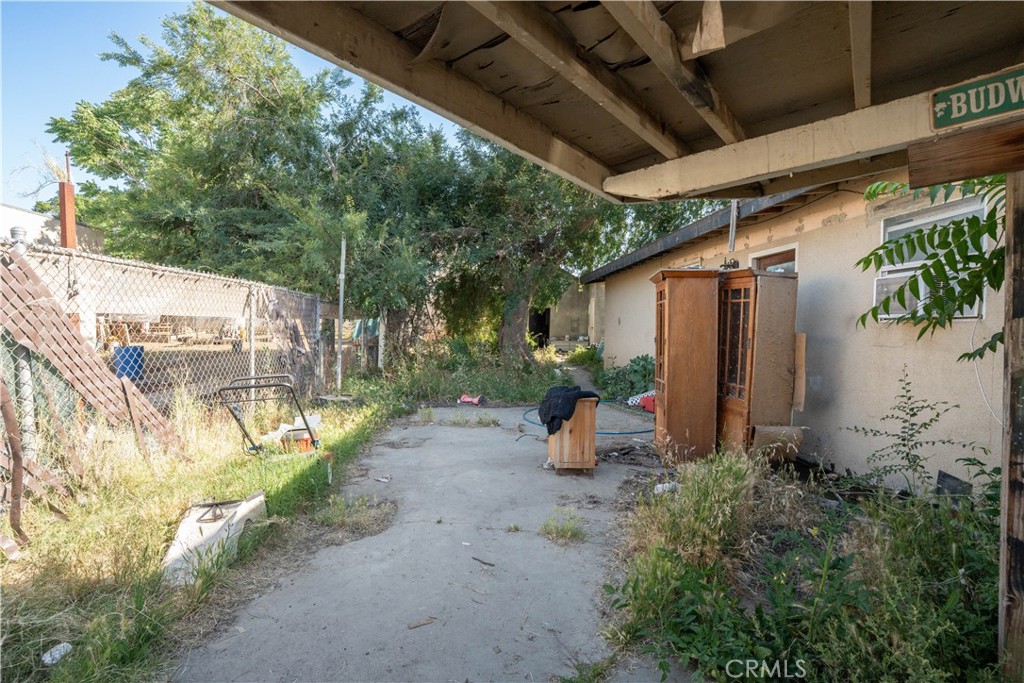 6174 Jurupa Avenue Riverside, CA 92504 - Photo 7 of 30 a view of a patio with table and chairs and potted plants