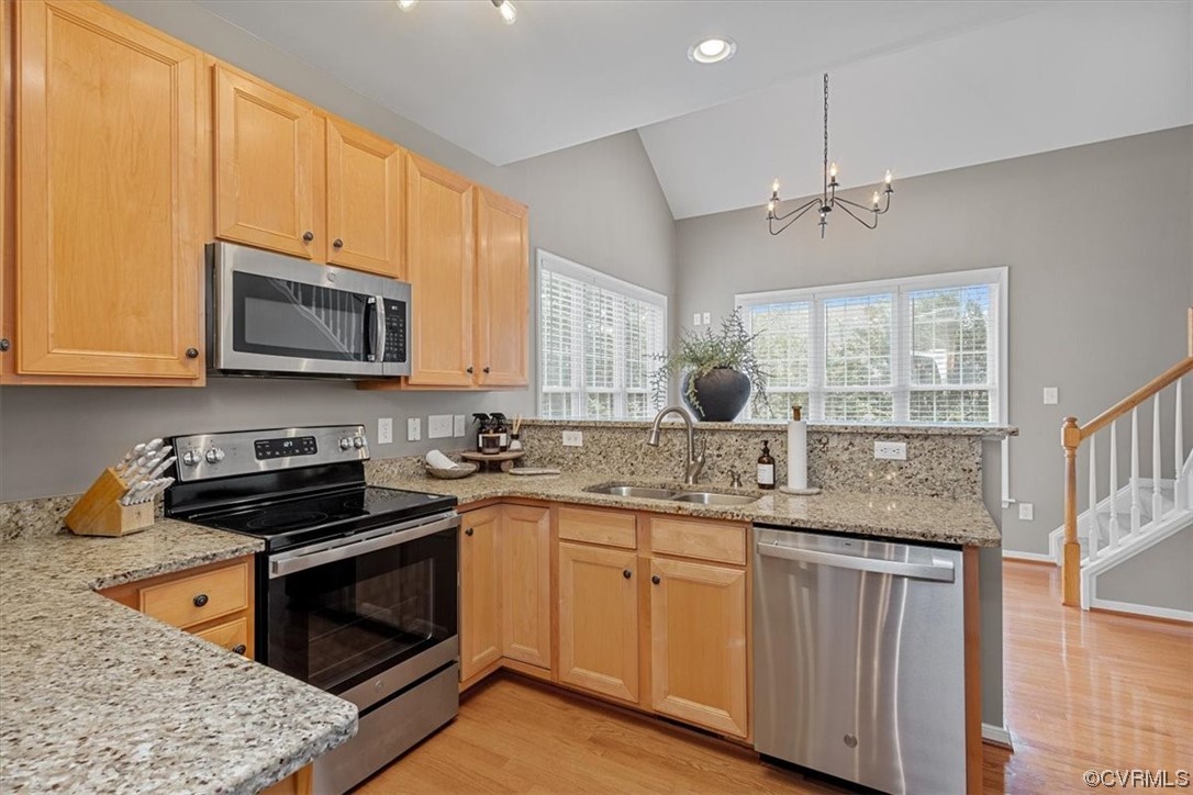 14825 Windjammer Drive Midlothian, VA 23112 - Photo 14 of 47 a kitchen with stainless steel appliances granite countertop wooden cabinets stove a sink and dishwasher with wooden floor