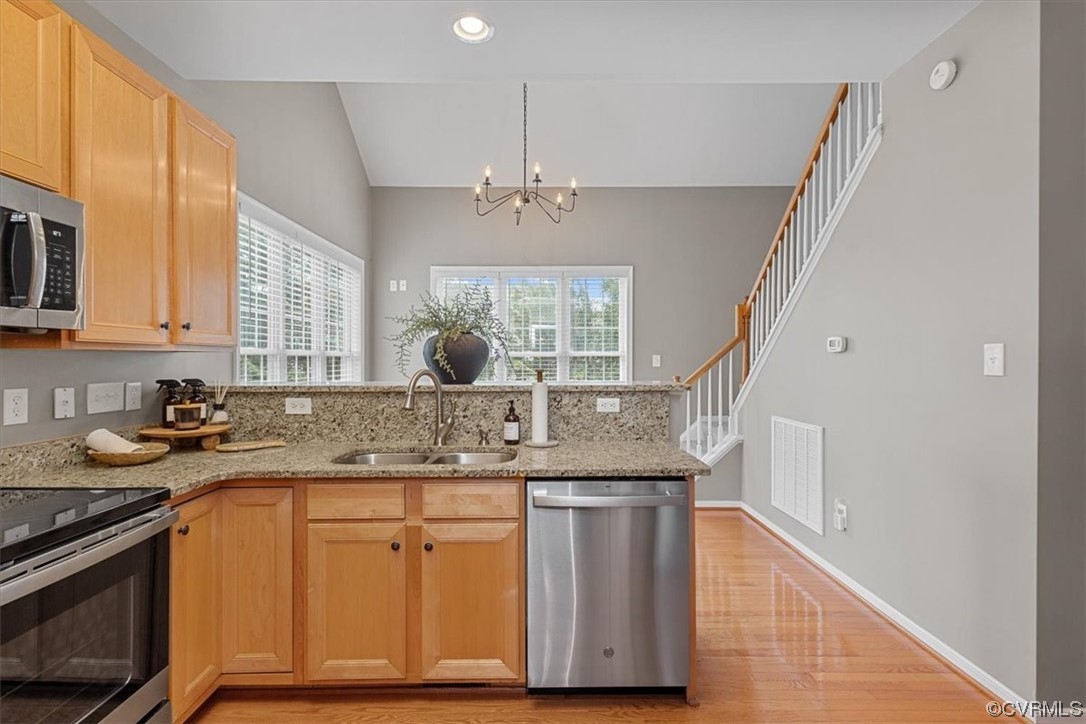 14825 Windjammer Drive Midlothian, VA 23112 - Photo 15 of 47 a kitchen with stainless steel appliances granite countertop a sink and a stove