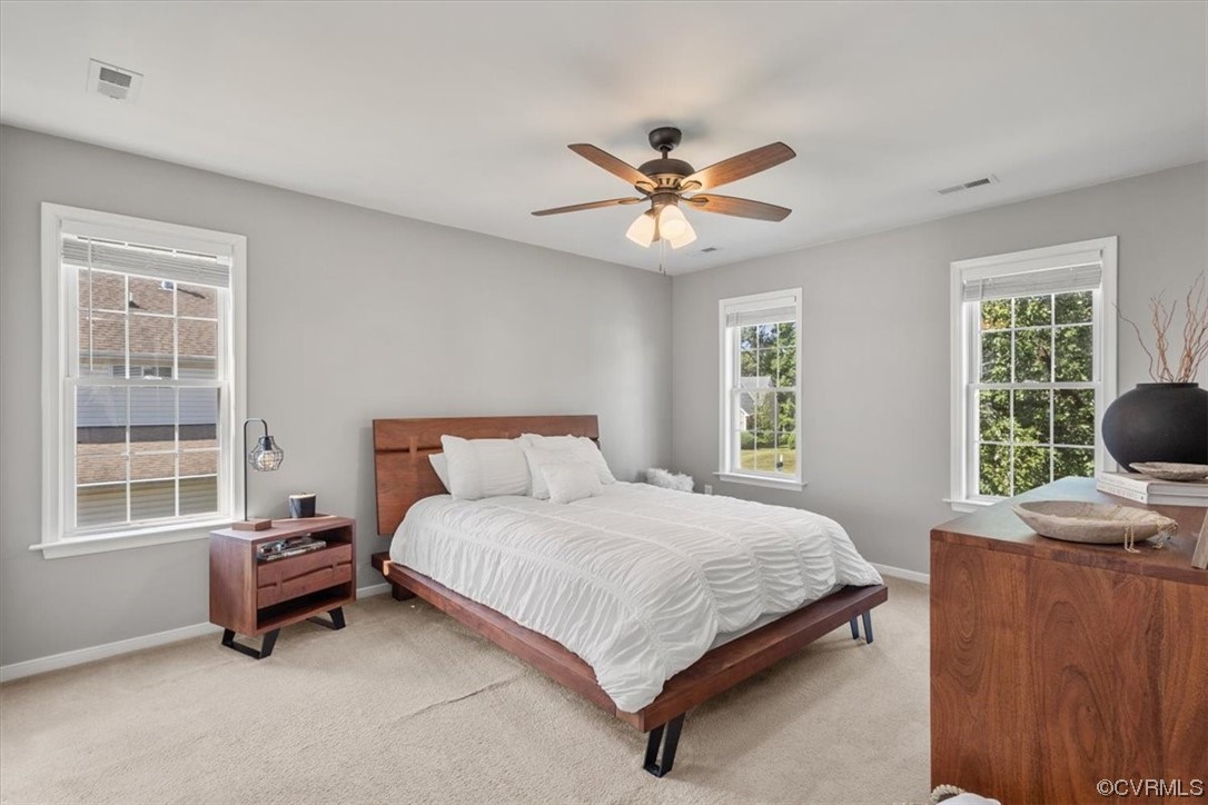 14825 Windjammer Drive Midlothian, VA 23112 - Photo 21 of 47 a bedroom with a bed and a window