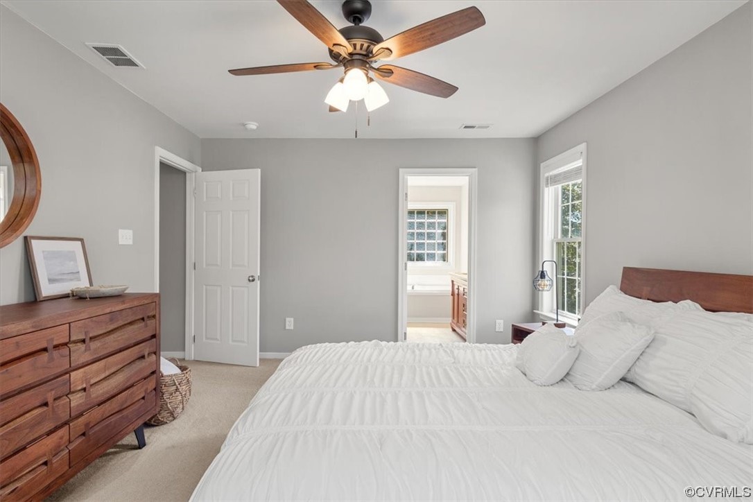 14825 Windjammer Drive Midlothian, VA 23112 - Photo 23 of 47 a bedroom with a large bed and a chandelier
