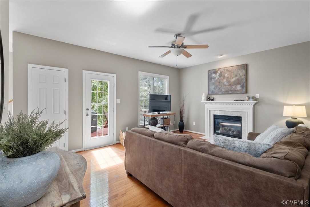 14825 Windjammer Drive Midlothian, VA 23112 - Photo 9 of 47 a living room with furniture a fireplace and a large window
