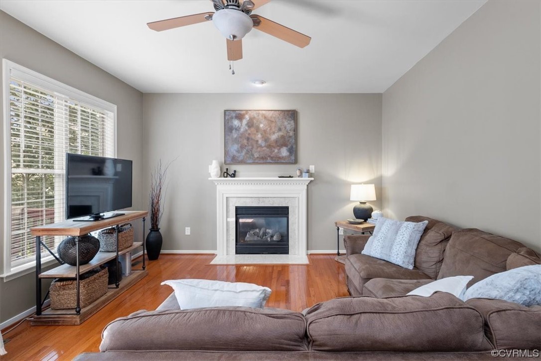 14825 Windjammer Drive Midlothian, VA 23112 - Photo 10 of 47 a living room with furniture a flat screen tv and a fireplace