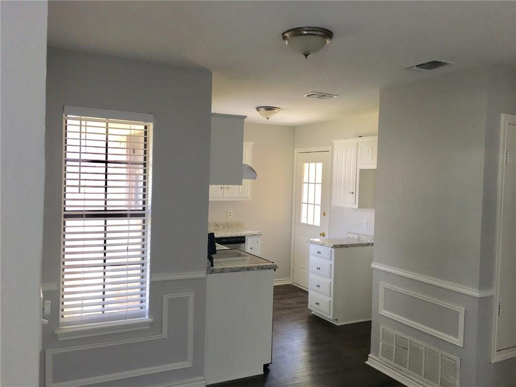 1005.5 Pine Street, Unit 1005 5 McKinney, TX 75069 - Photo 3 of 11 a view of empty room with wooden floor and fan