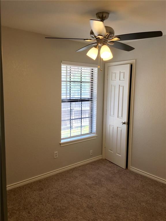 1005.5 Pine Street, Unit 1005 5 McKinney, TX 75069 - Photo 7 of 11 a view of an empty room with a window