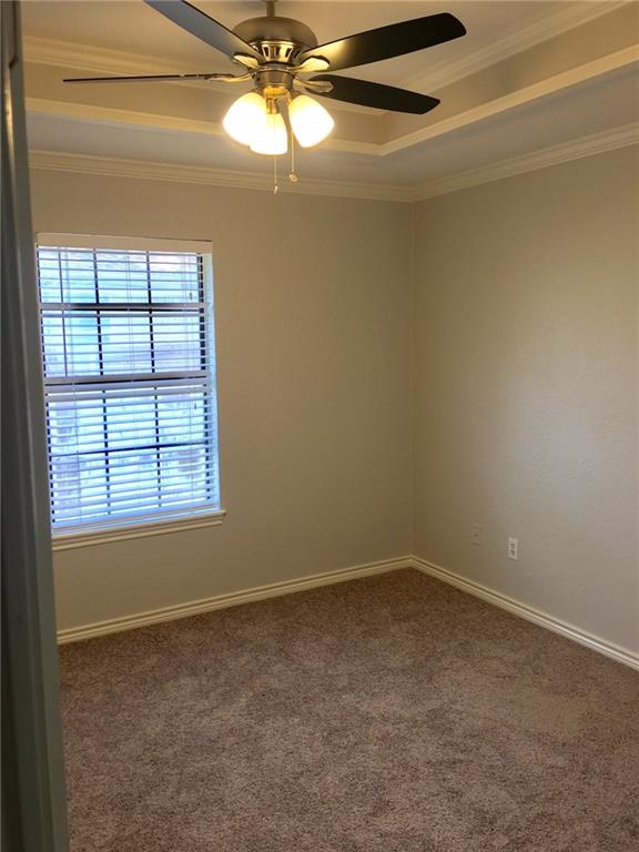 1005.5 Pine Street, Unit 1005 5 McKinney, TX 75069 - Photo 8 of 11 an empty room with a window