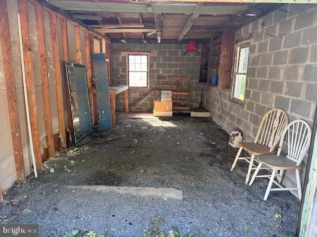 a view of a chairs in a backyard