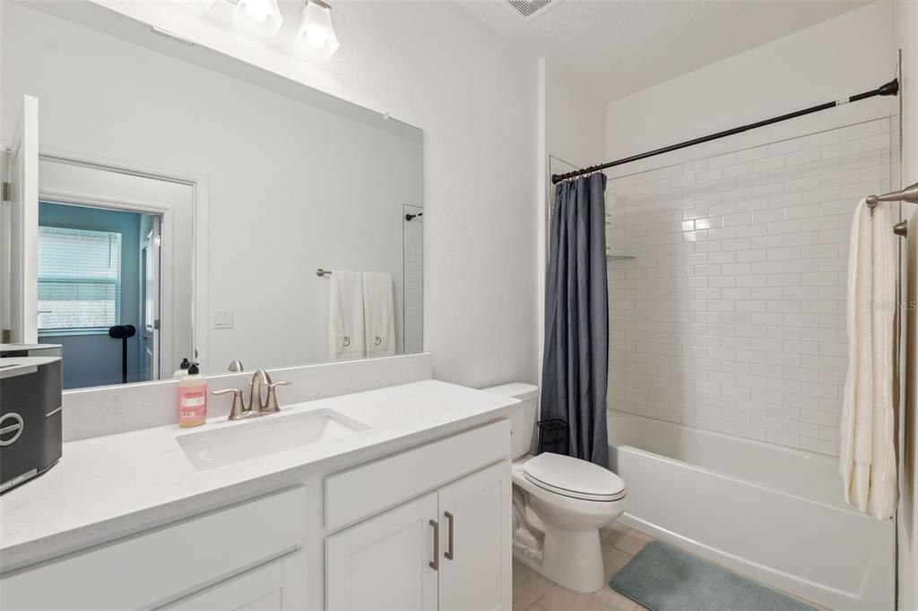 16787 Shell Bay Drive Land O Lakes, FL 34638 - Photo 20 of 54 a bathroom with a sink a toilet and shower