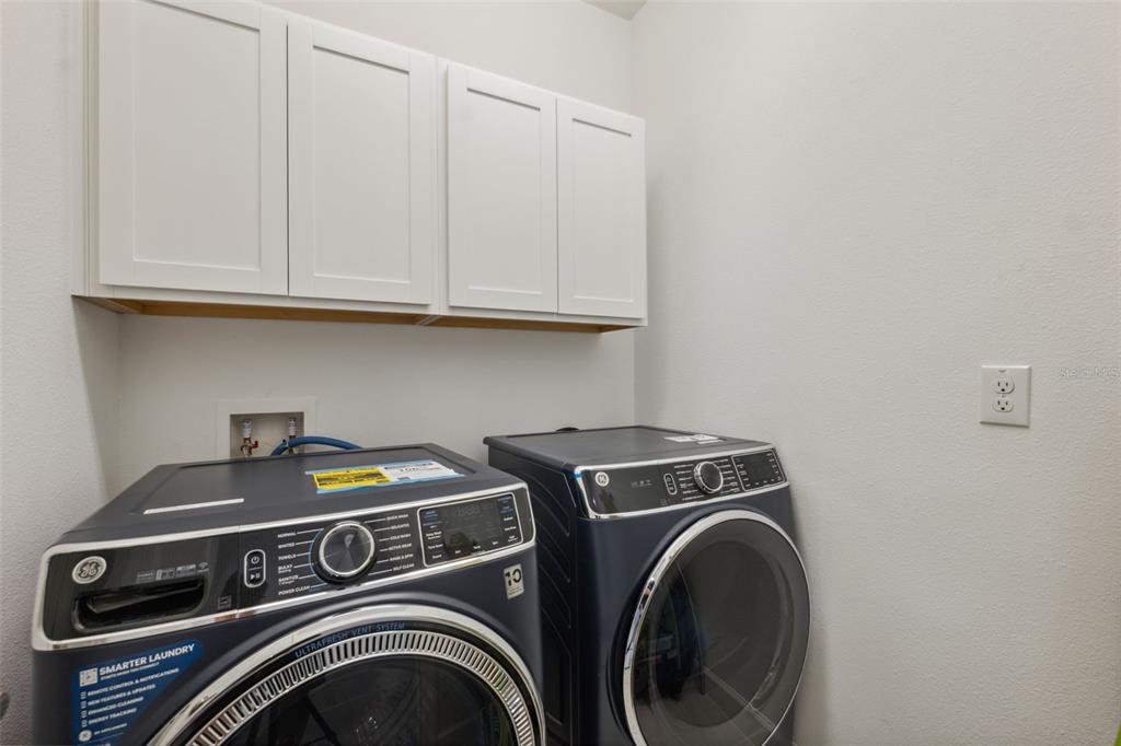 16787 Shell Bay Drive Land O Lakes, FL 34638 - Photo 21 of 54 a utility room with dryer and washer