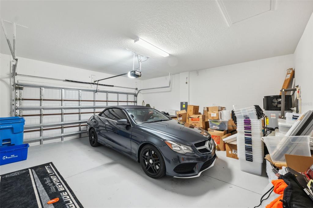 16787 Shell Bay Drive Land O Lakes, FL 34638 - Photo 22 of 54 a view of a garage with parked cars