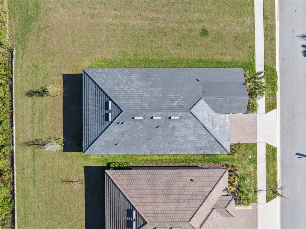16787 Shell Bay Drive Land O Lakes, FL 34638 - Photo 33 of 54 an aerial view of a house with a yard