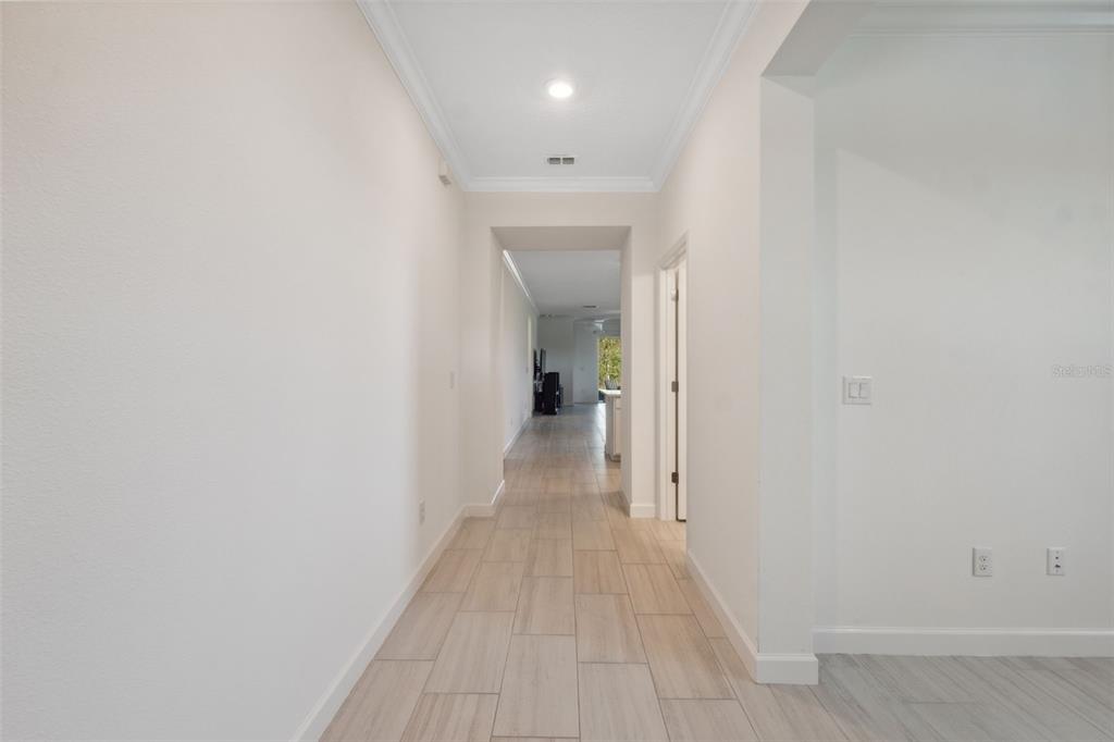 16787 Shell Bay Drive Land O Lakes, FL 34638 - Photo 4 of 54 a view of a hallway with wooden floor