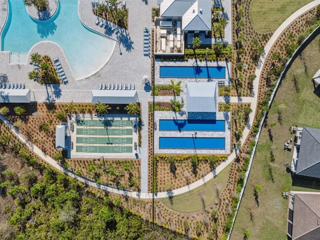 an aerial view of a house with outdoor space