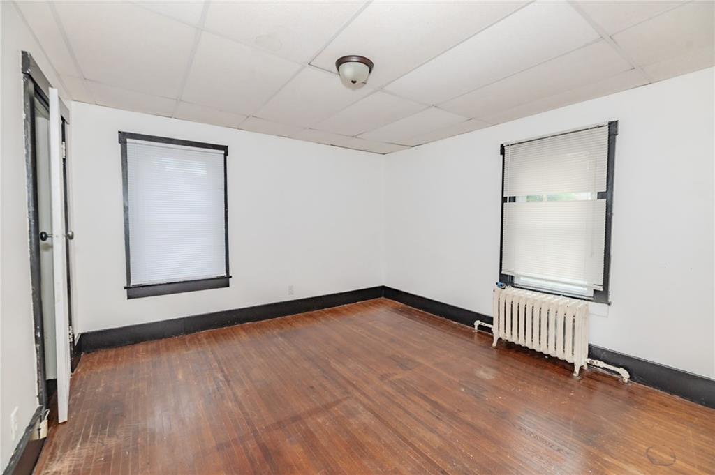 926 Oak Street, Unit 2 Indiana, PA 15701 - Photo 6 of 7 a view of an empty room with wooden floor and a window