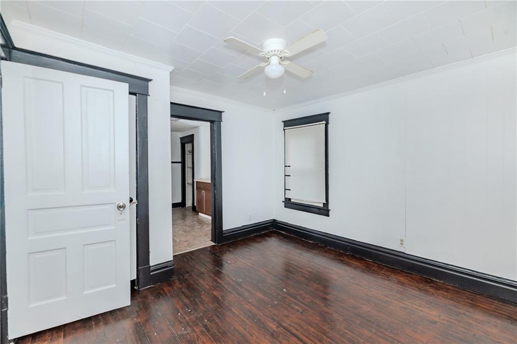 926 Oak Street, Unit 2 Indiana, PA 15701 - Photo 7 of 7 wooden floor in an empty room with a window