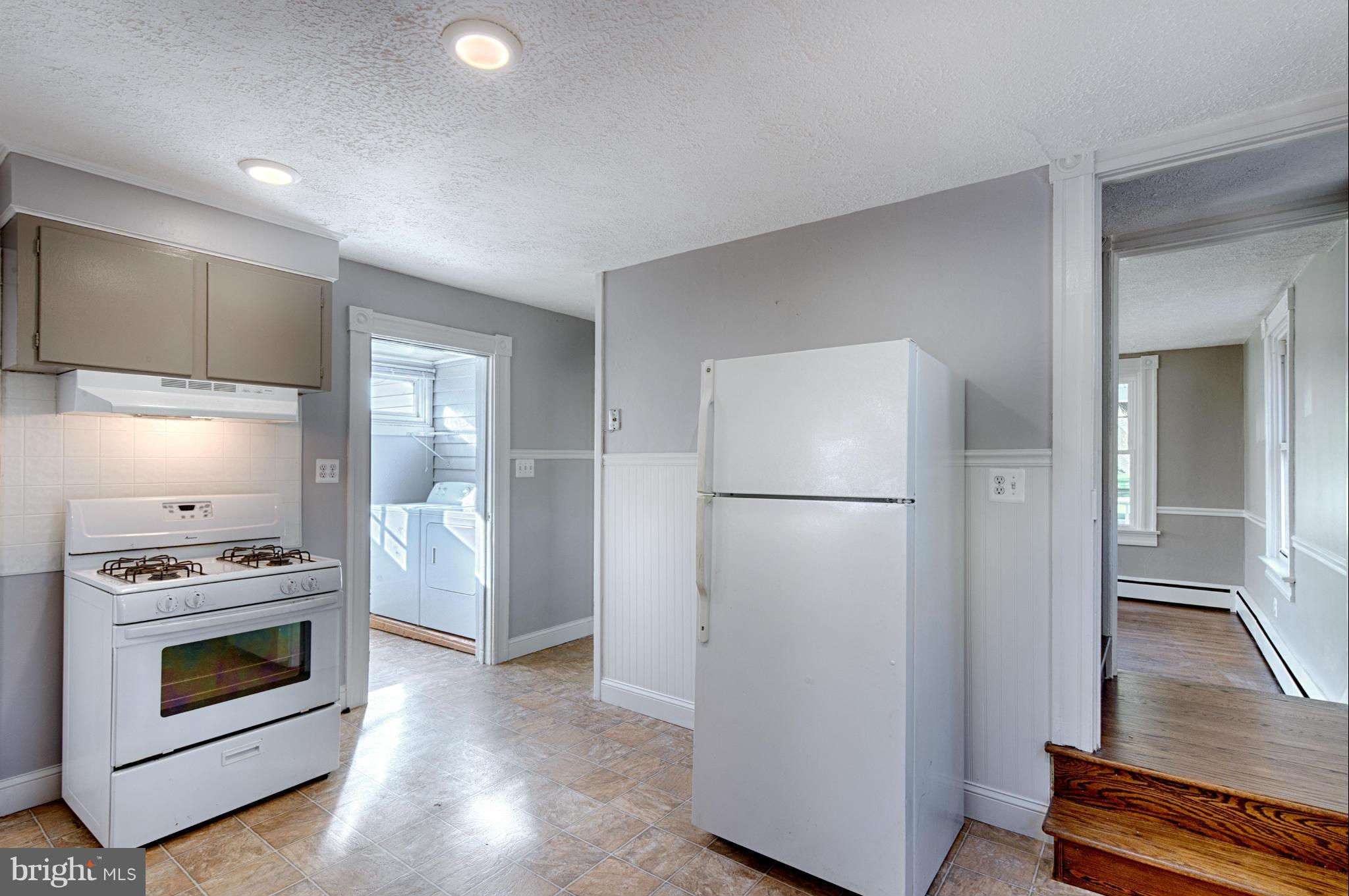 2415 Rocks Road Forest Hill, MD 21050 - Photo 27 of 30 a kitchen with a refrigerator and a stove top oven