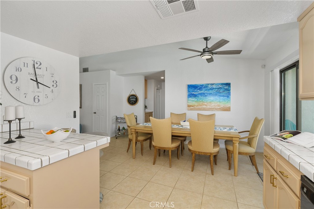 78680 Saguaro Road La Quinta, CA 92253 - Photo 14 of 30 a view of a dining room with furniture