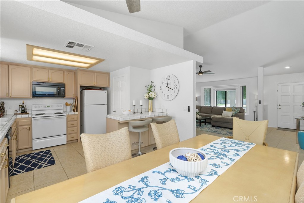 78680 Saguaro Road La Quinta, CA 92253 - Photo 15 of 30 a living room with furniture and a rug