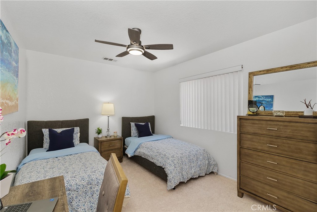 78680 Saguaro Road La Quinta, CA 92253 - Photo 24 of 30 a bedroom with a bed and a dresser
