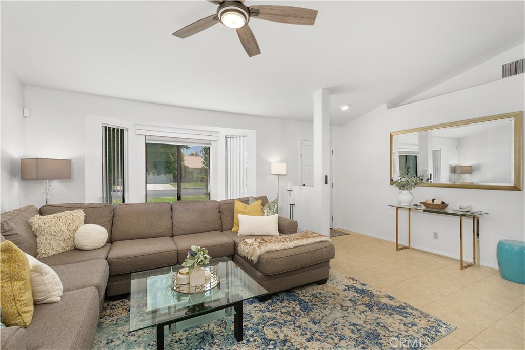 78680 Saguaro Road La Quinta, CA 92253 - Photo 5 of 30 a living room with furniture and a wooden floor