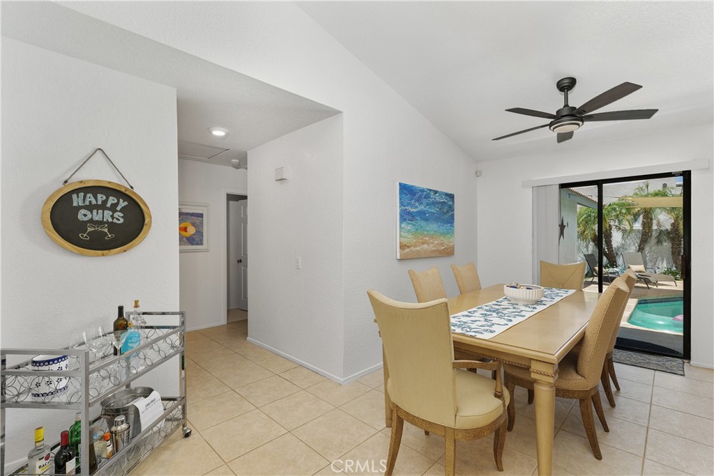 78680 Saguaro Road La Quinta, CA 92253 - Photo 8 of 30 a view of a dining room with furniture and a large window