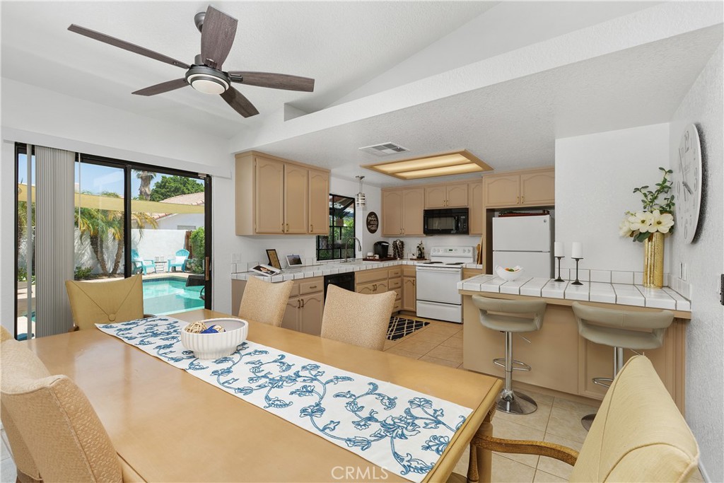 78680 Saguaro Road La Quinta, CA 92253 - Photo 9 of 30 a living room with furniture and a large window