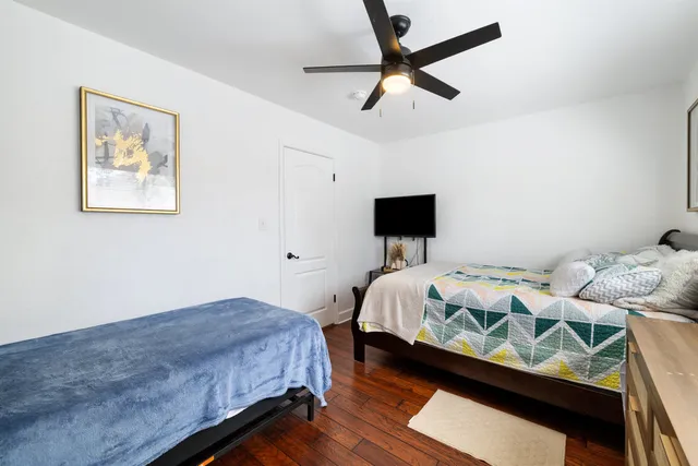 a bedroom with bed and tv