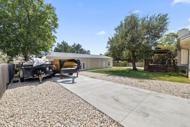 a view of a backyard with sitting area