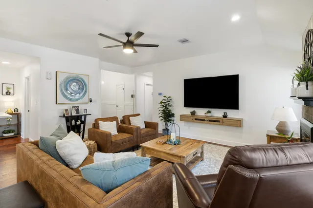 a living room with furniture and a flat screen tv