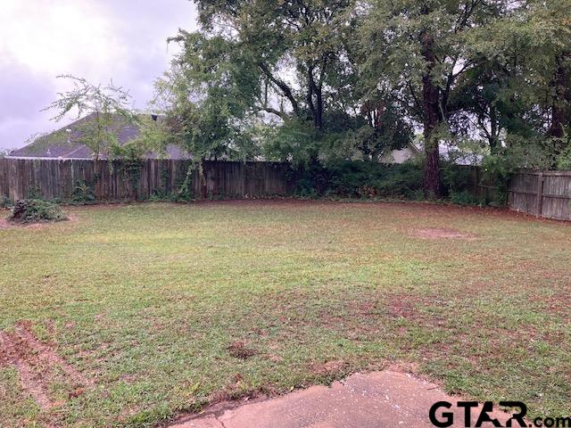 320 Blake Drive Longview, TX 75604 - Photo 2 of 9 a backyard of a house with lots of green space