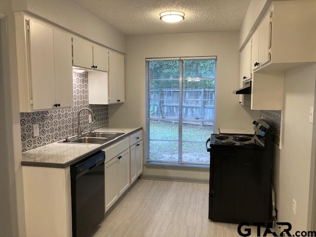 320 Blake Drive Longview, TX 75604 - Photo 5 of 9 a kitchen with a sink stove and refrigerator