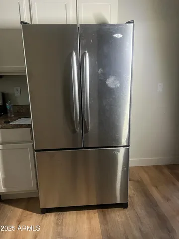 a view of a refrigerator in kitchen