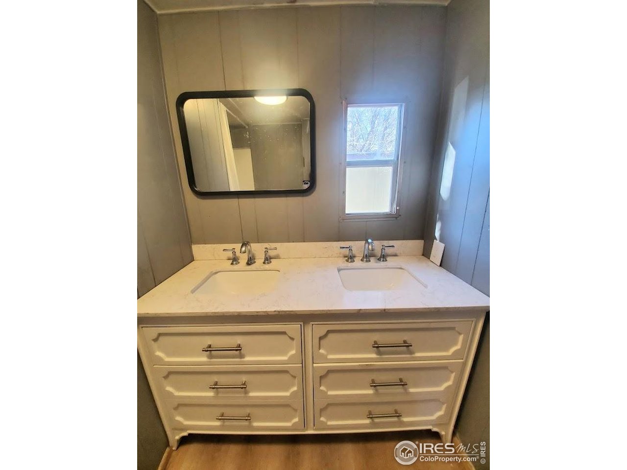 1212 Butte Road, Unit 20 Loveland, CO 80537 - Photo 11 of 22 a bathroom with a sink and a mirror