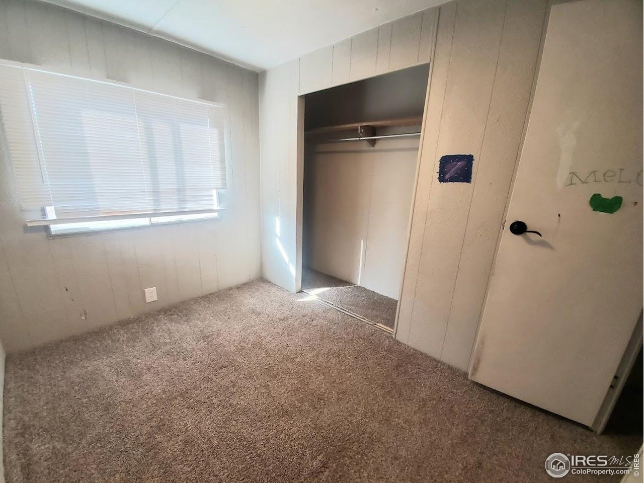 1212 Butte Road, Unit 20 Loveland, CO 80537 - Photo 14 of 22 a view of empty room with front door