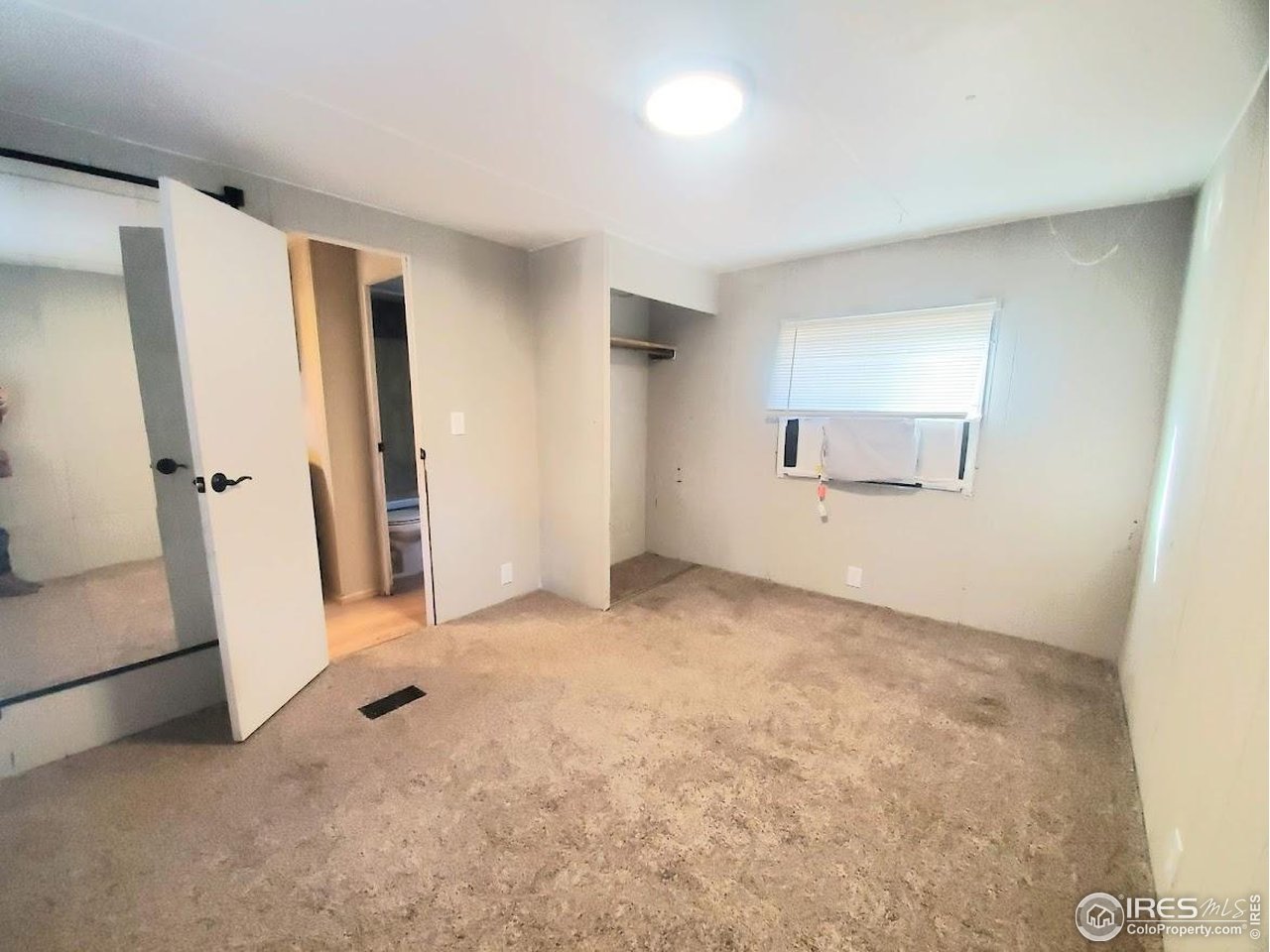 1212 Butte Road, Unit 20 Loveland, CO 80537 - Photo 18 of 22 wooden floor in an empty room