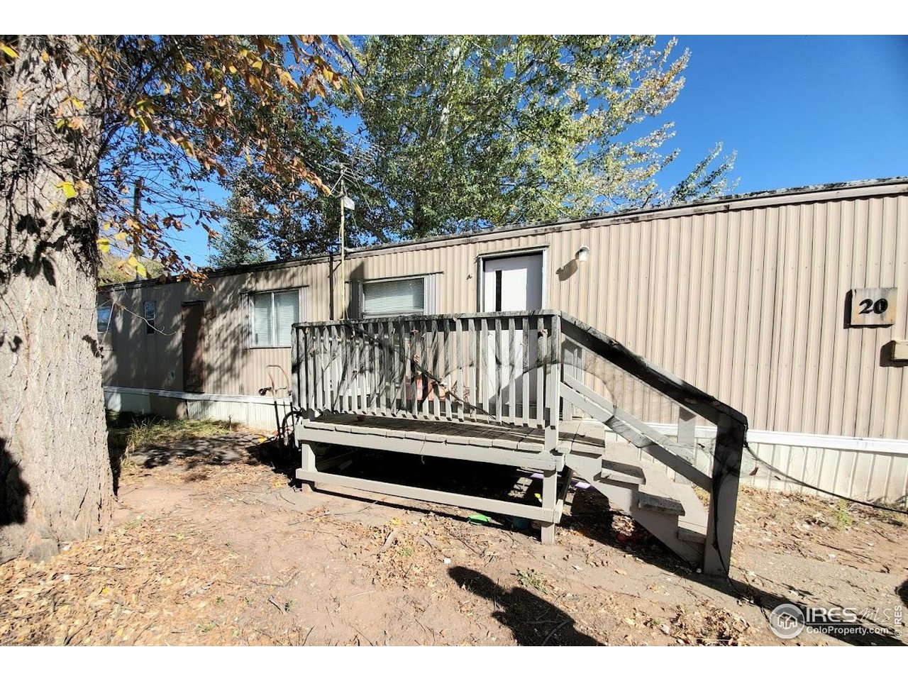 1212 Butte Road, Unit 20 Loveland, CO 80537 - Photo 19 of 22 a view of stairs and wooden fence