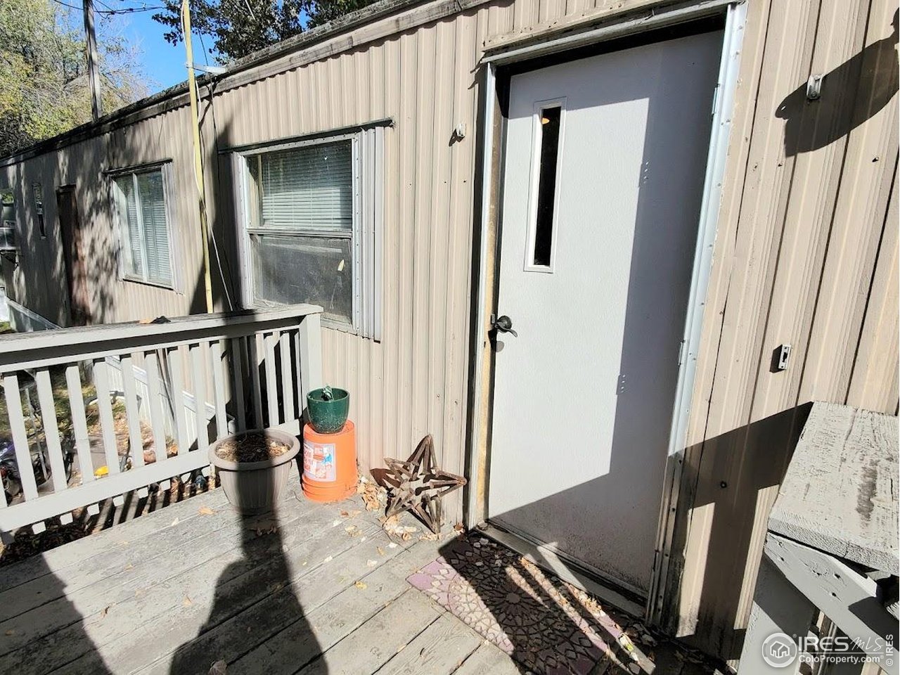 1212 Butte Road, Unit 20 Loveland, CO 80537 - Photo 2 of 22 a view of a balcony with furniture