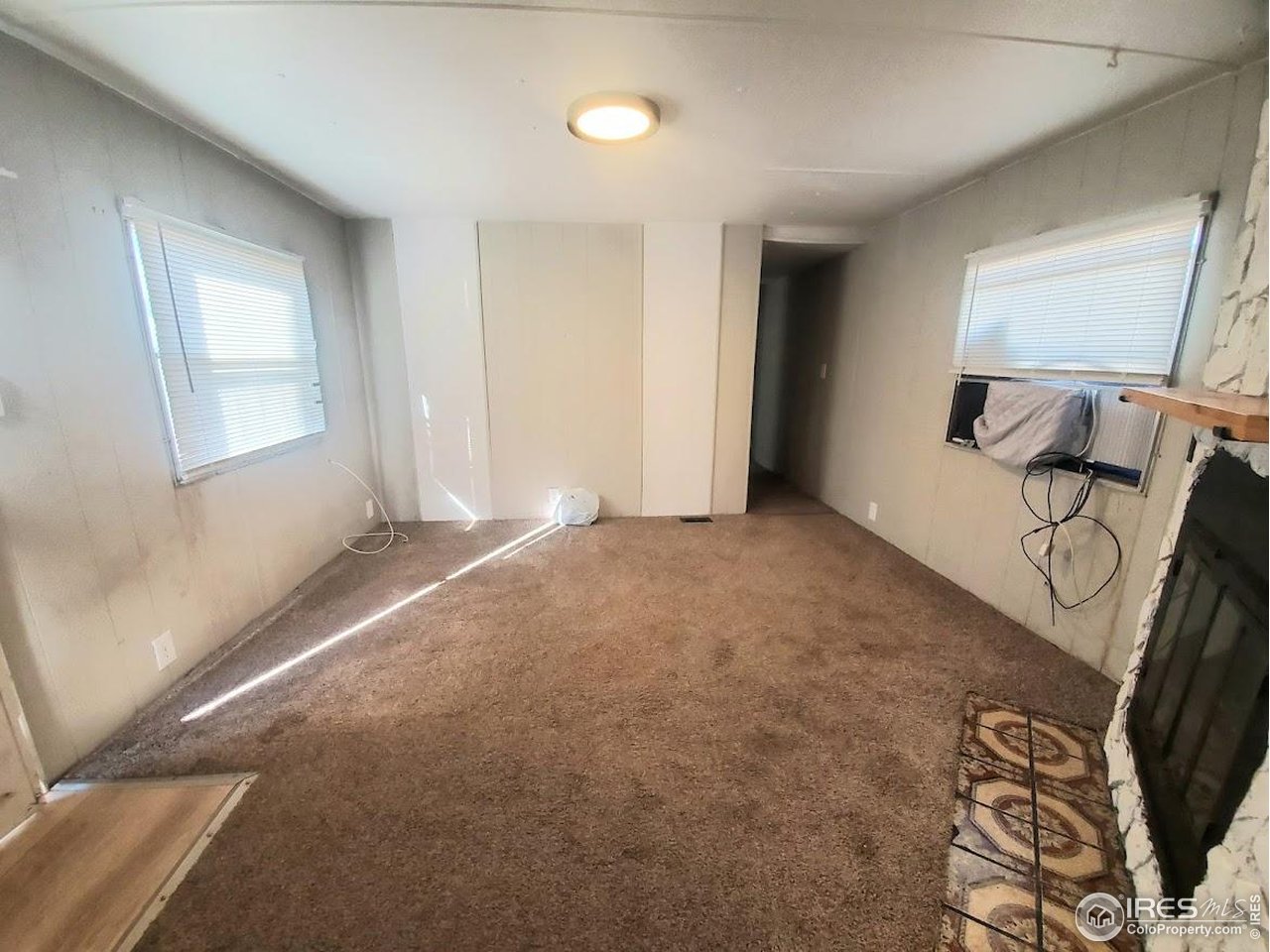 1212 Butte Road, Unit 20 Loveland, CO 80537 - Photo 4 of 22 a view of a livingroom with a staircase