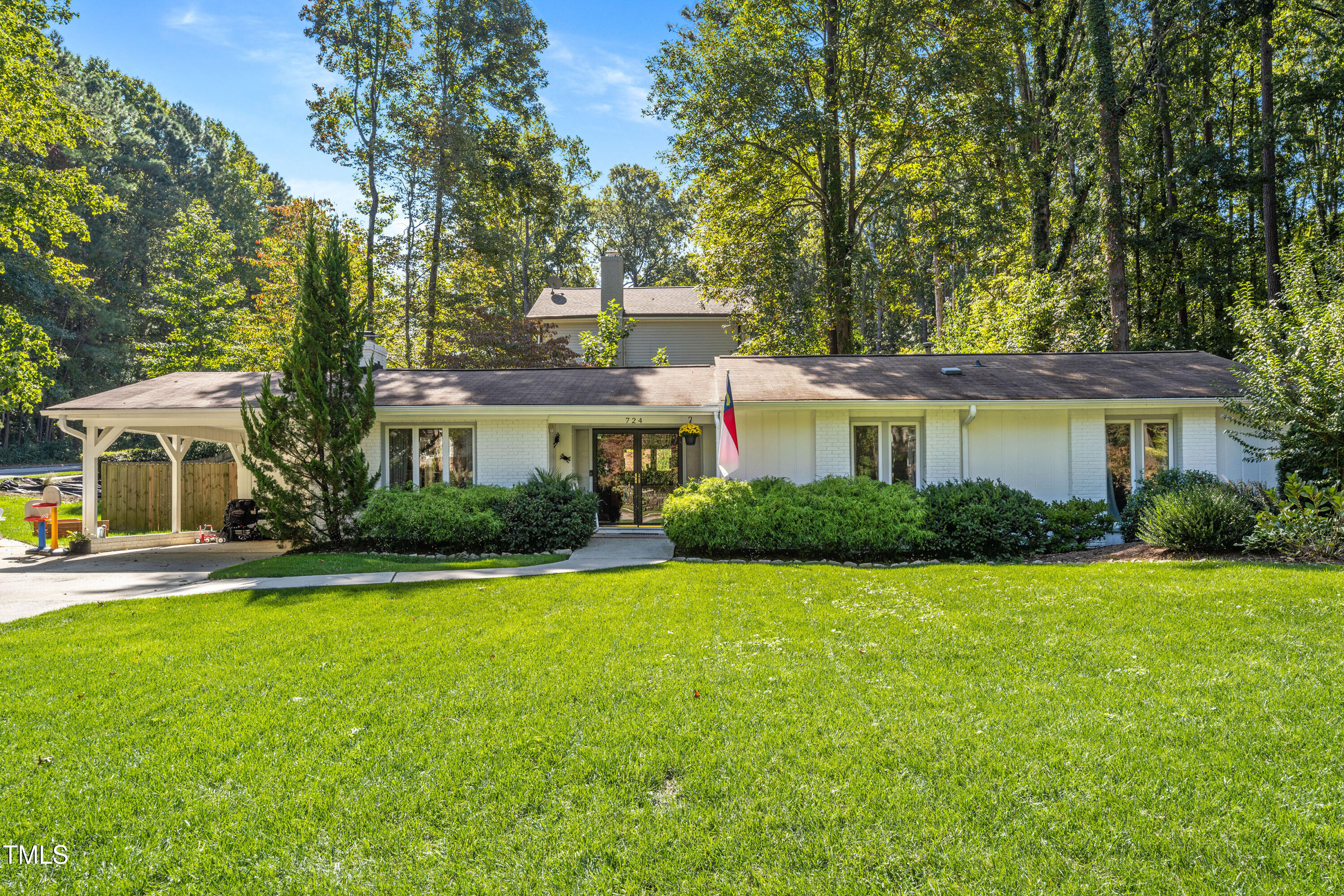 724 Hunting Ridge Road Raleigh, NC 27615 - Photo 1 of 24 a front view of a house with a yard